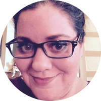 photo of a woman's face. She's wearing eyeglasses